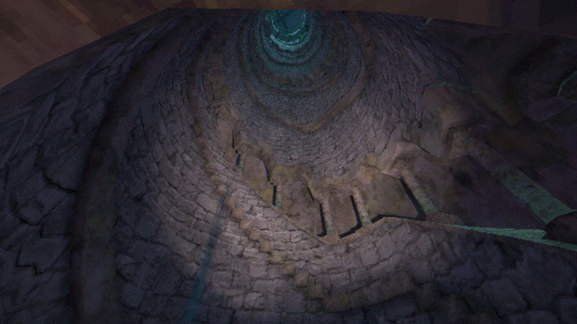 Looking down the shaft of a deep stone well